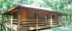 Hot Tub and wrap around porch on a cabin in Eureka springs Arkansas